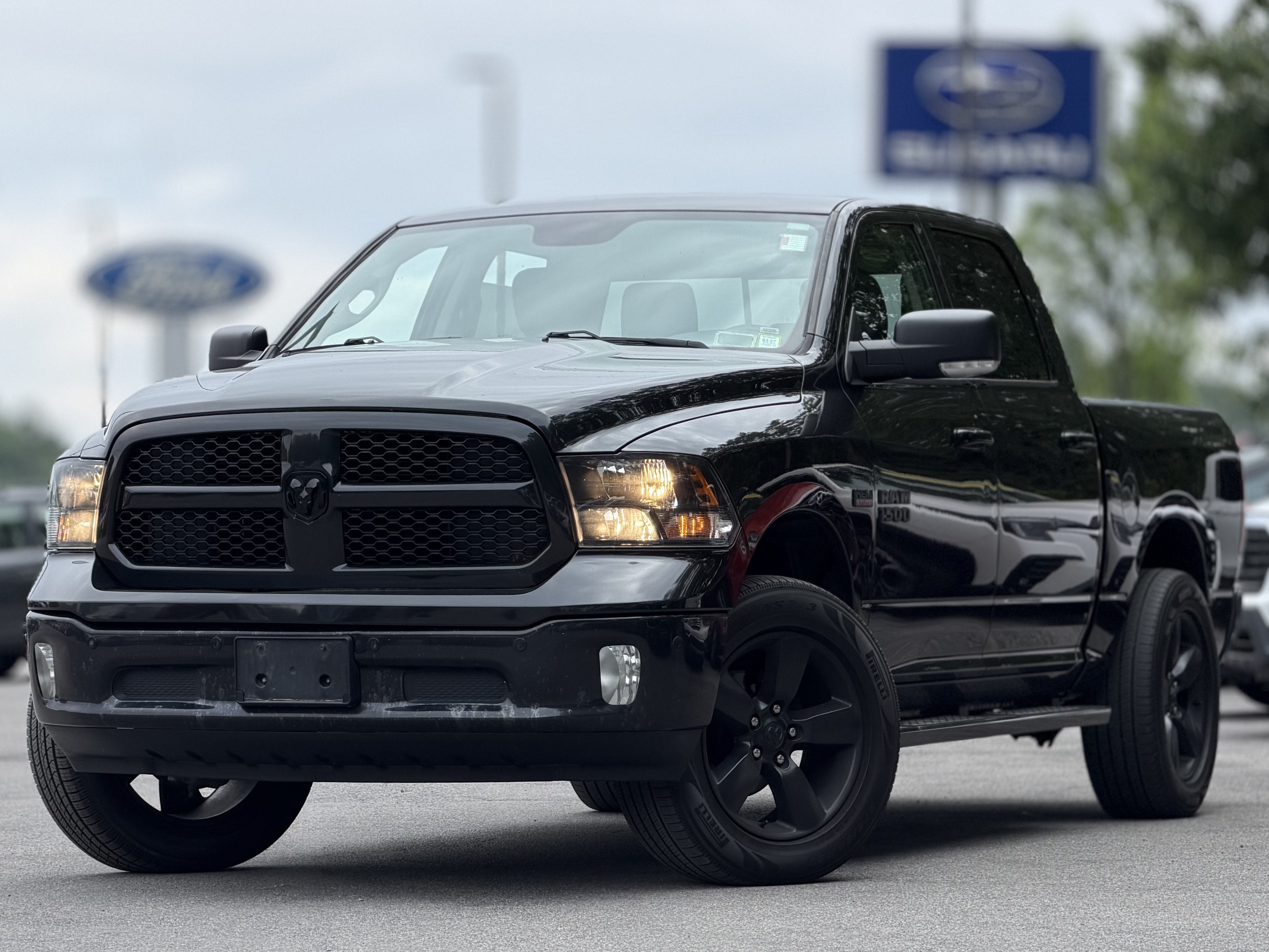 2018 RAM 1500 Big Horn in Brilliant Black Crystal Pearlcoat — front three-quarter view