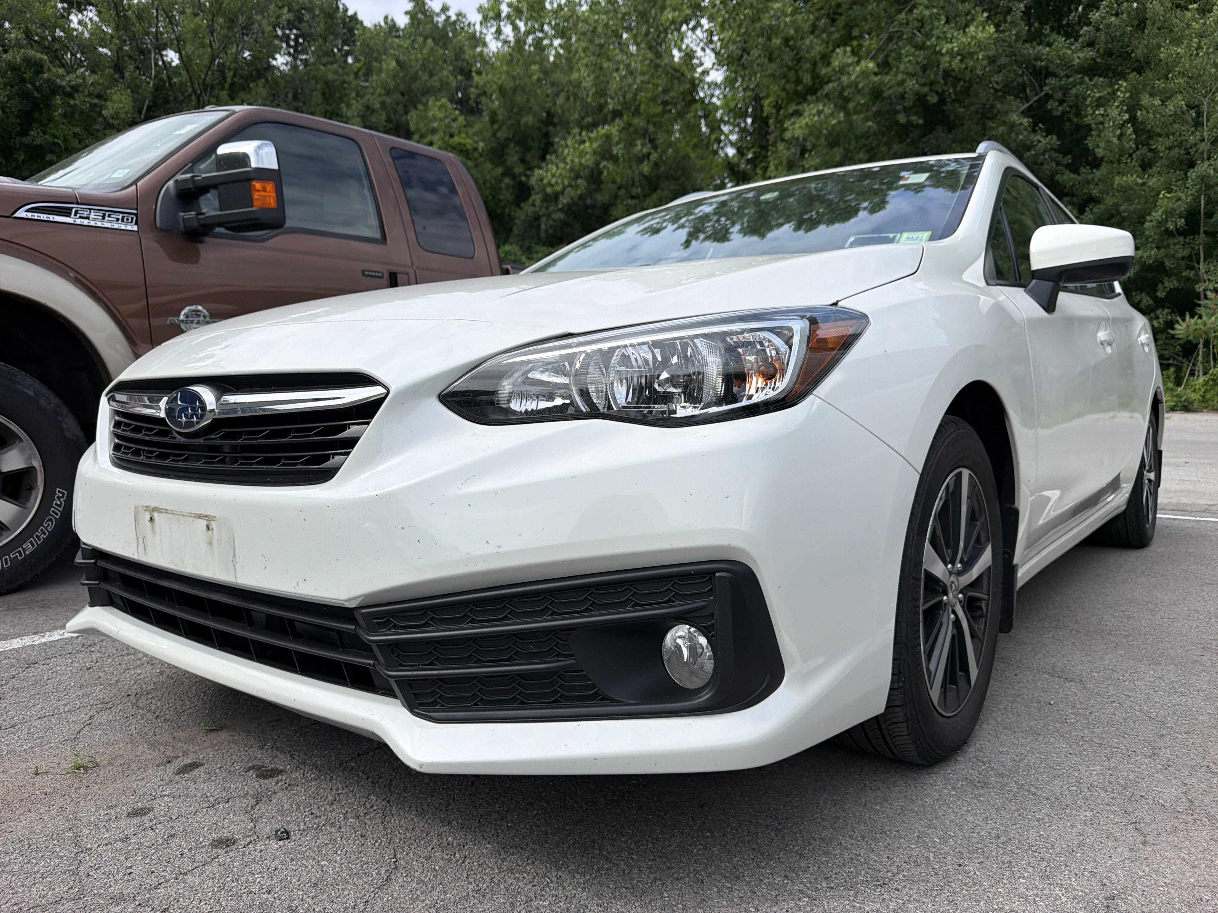 2023 Subaru Impreza Premium in Crystal White Pearl — front three-quarter view