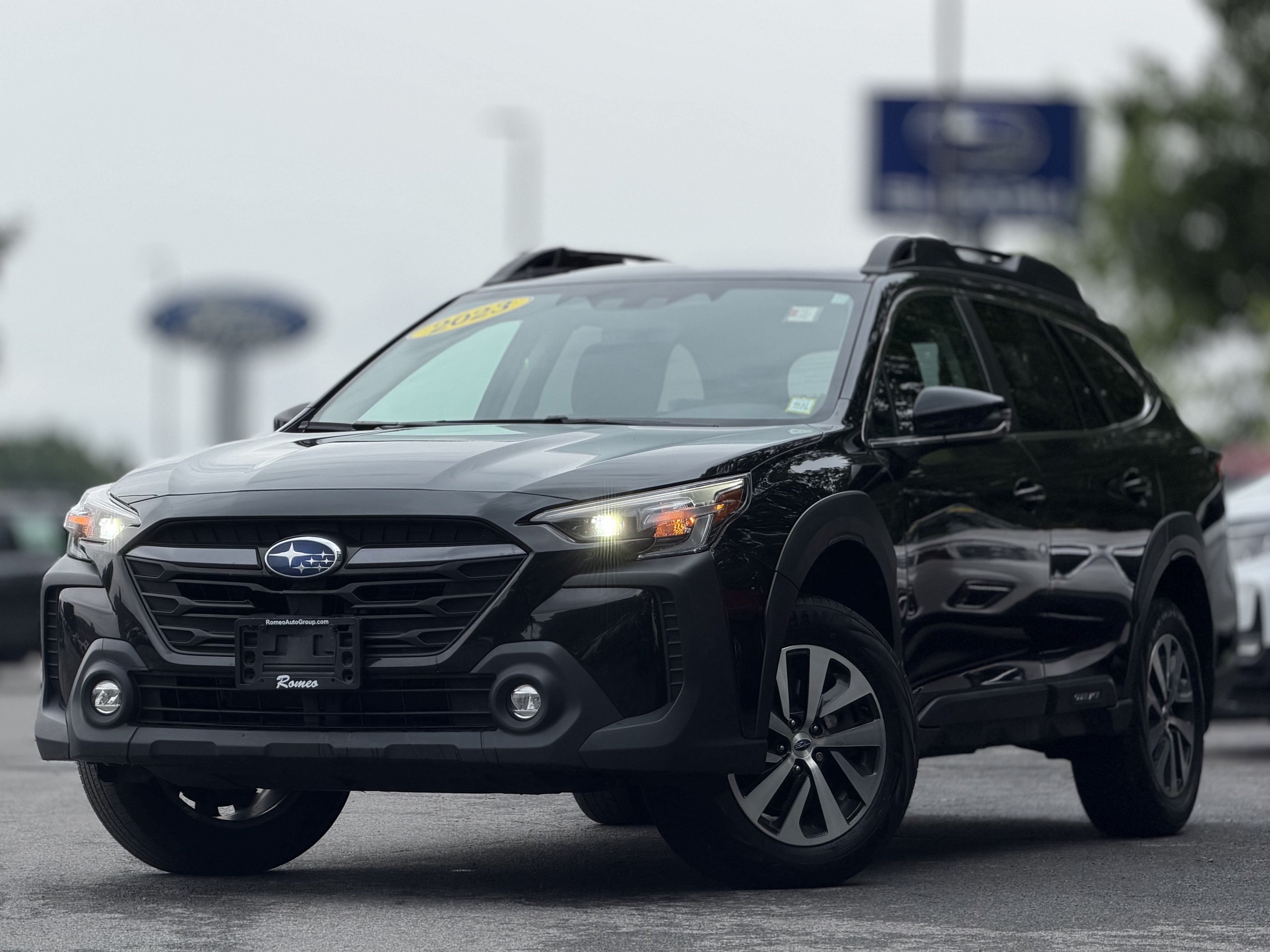 2023 Subaru Outback Premium in Crystal Black Silica — front three-quarter view