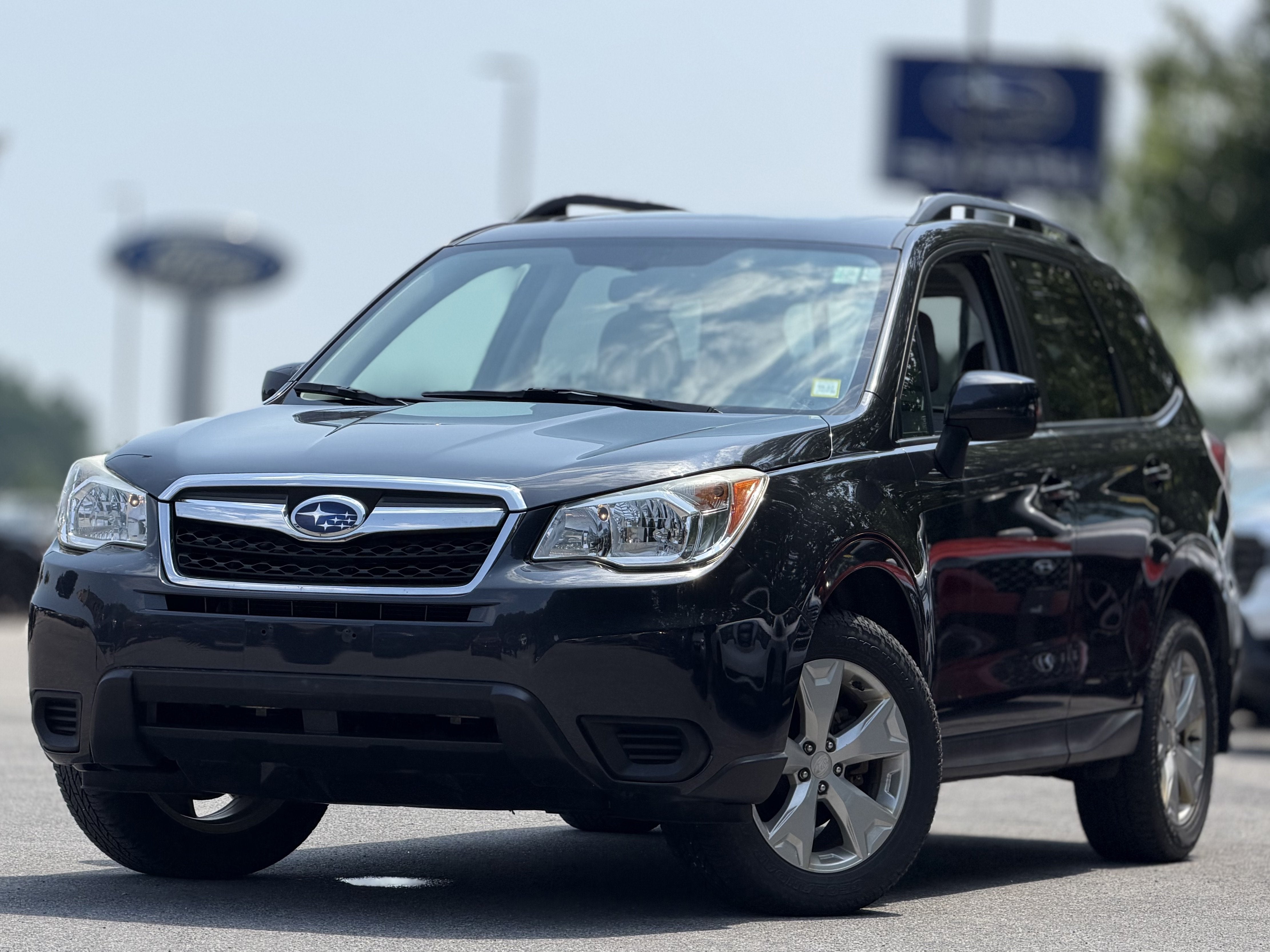 2015 Subaru Forester 2.5i Premium in Dark Gray Metallic — front three-quarter view